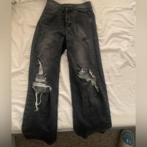 Washed out black ripped denim jeans